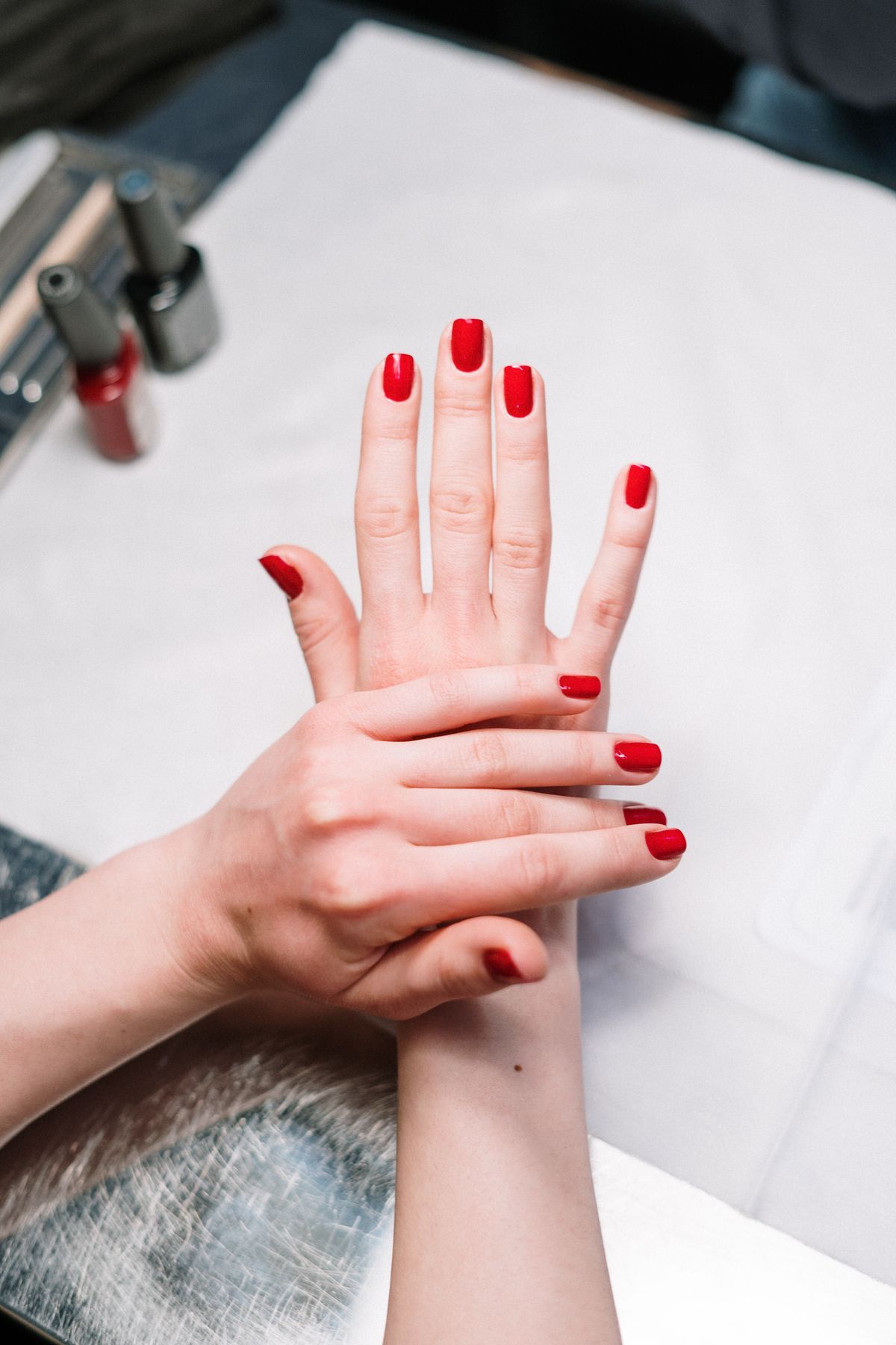 Finished red manicure by Flora Nails & Spa