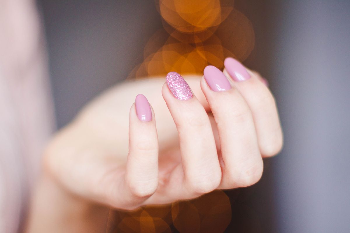 Pink glitter gel manicure at Flora Nails & Spa